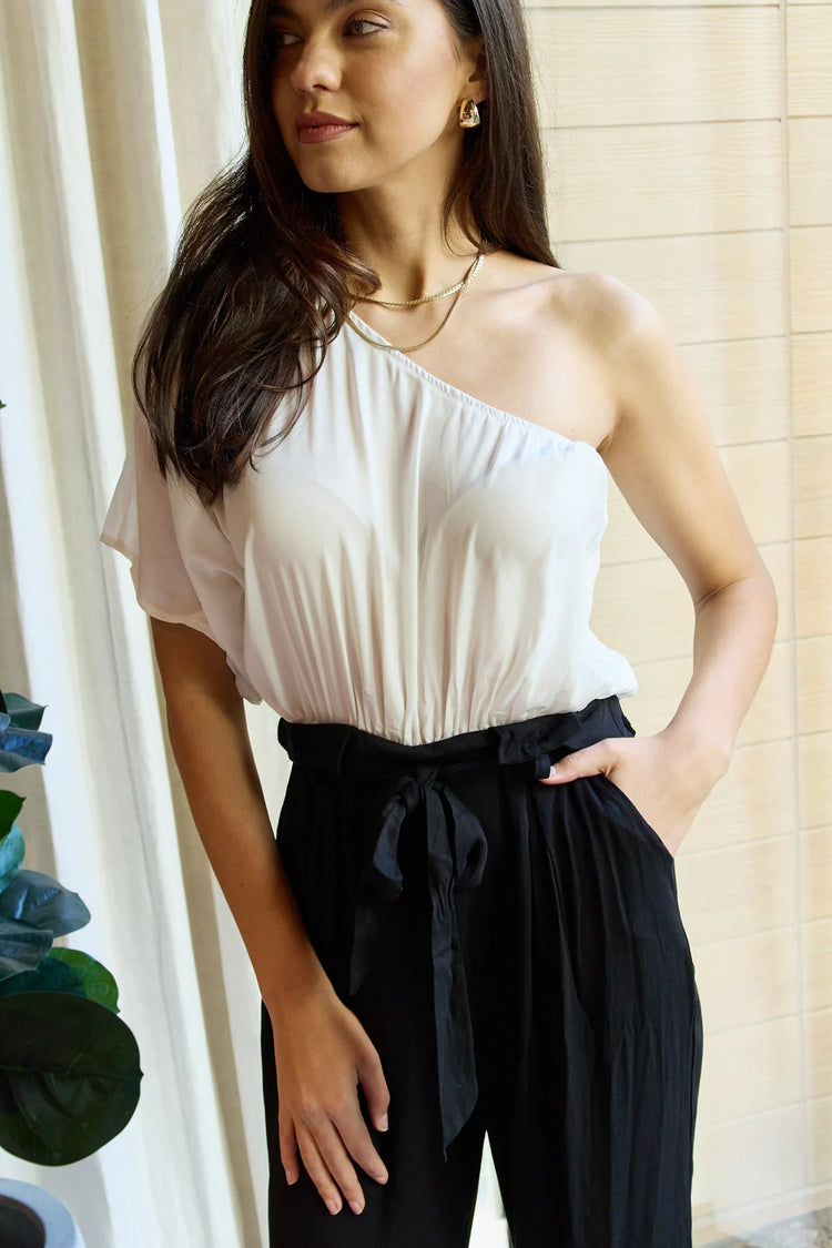 one-shoulder jumpsuit in white black