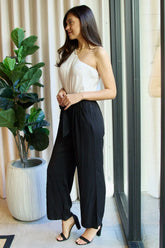 one-shoulder jumpsuit in white black